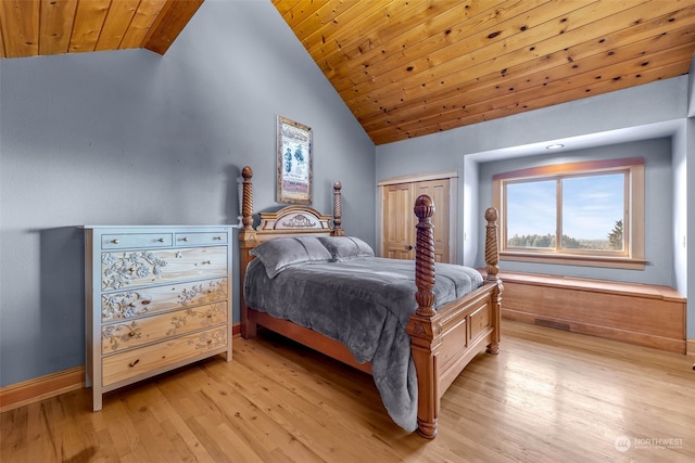 bedroom featuring a closet, vaulted ceiling, light wood-type flooring, and wooden ceiling