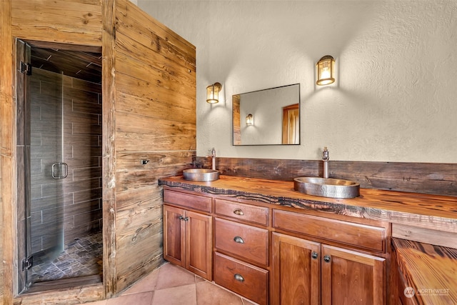 bathroom featuring vanity, tile patterned floors, and an enclosed shower