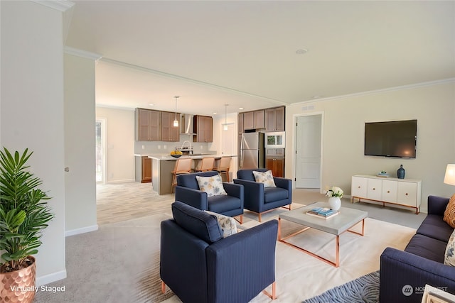 living room with sink, light colored carpet, and ornamental molding