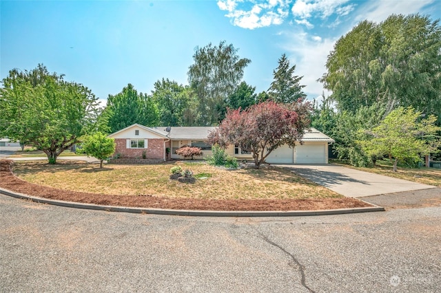 ranch-style house with a garage, concrete driveway, and brick siding