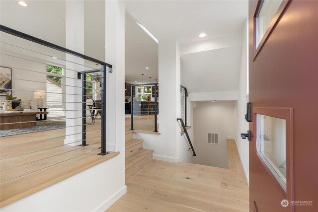 hallway with light wood-type flooring