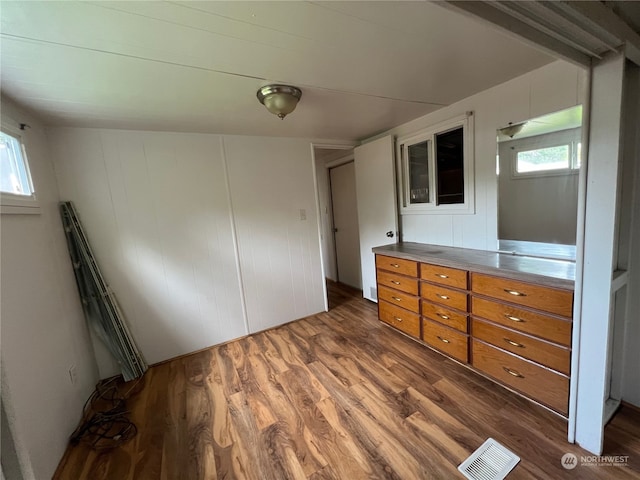 unfurnished bedroom featuring dark hardwood / wood-style flooring