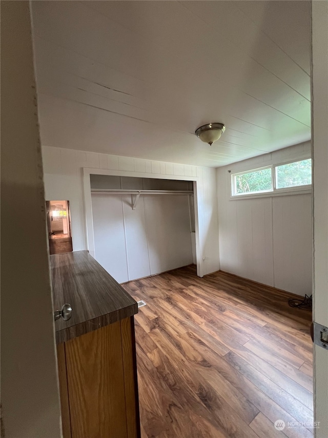 interior space featuring a closet and hardwood / wood-style flooring