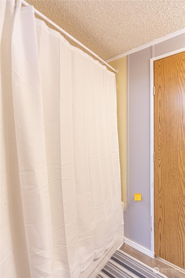 bathroom featuring a textured ceiling