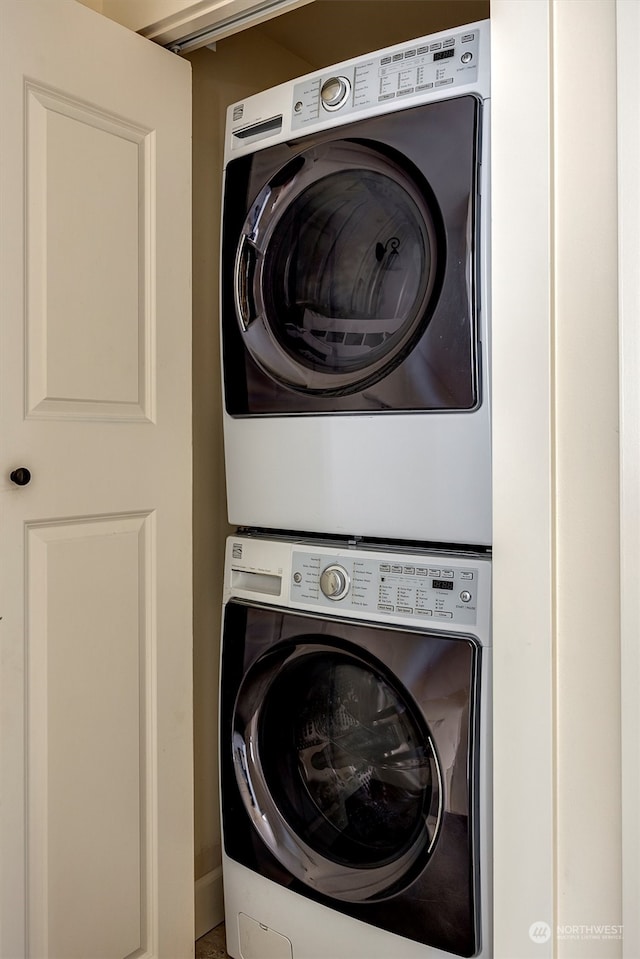 laundry room featuring stacked washer / dryer