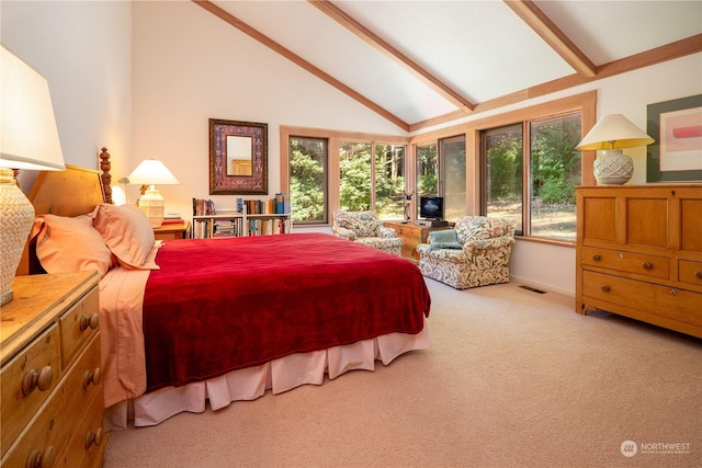 bedroom with light carpet, multiple windows, visible vents, and beamed ceiling