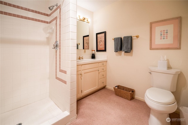 full bath featuring toilet, a shower stall, baseboards, and vanity