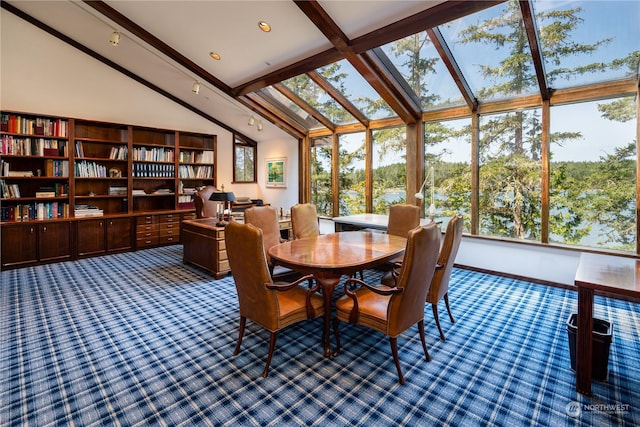 dining room with carpet floors, beamed ceiling, and high vaulted ceiling