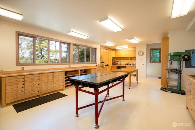 playroom featuring finished concrete flooring