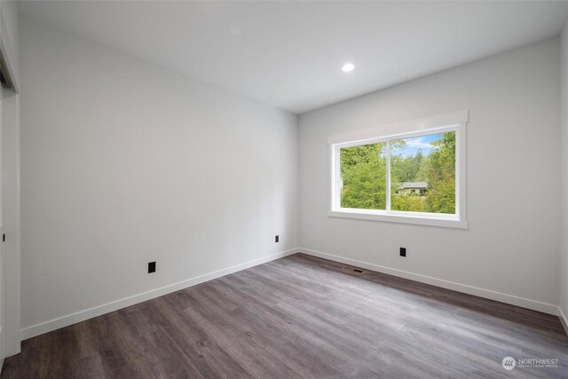 empty room featuring hardwood / wood-style floors