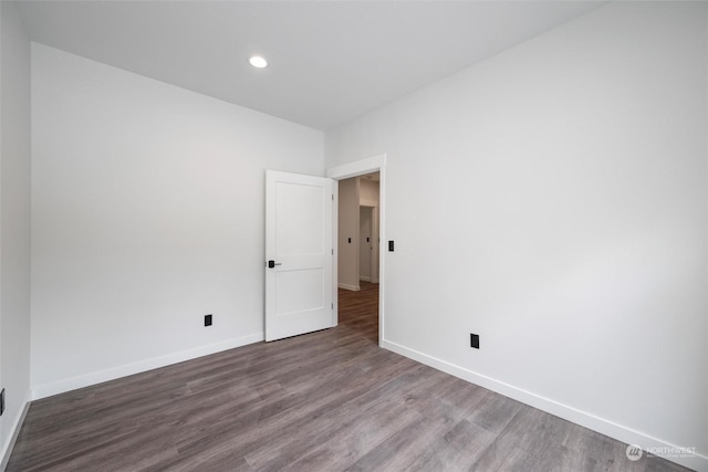 empty room featuring dark hardwood / wood-style flooring