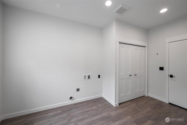 washroom featuring electric dryer hookup, hookup for a washing machine, and dark hardwood / wood-style floors