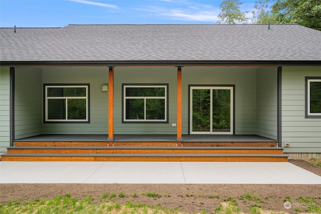 doorway to property with a patio area