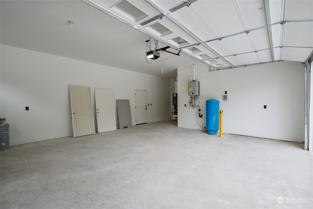 garage with a garage door opener and water heater