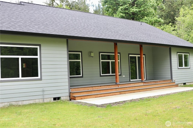 8710 Trillium Ln, Concrete, WA 98237 - rear view of house with covered porch, roof with shingles, and a yard