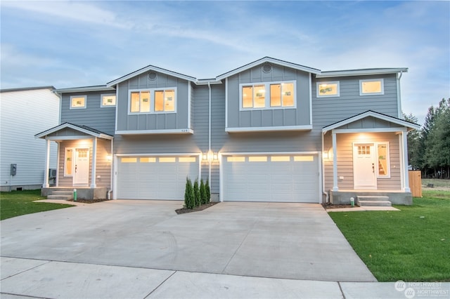 view of front of home with a garage and a front lawn