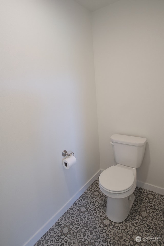 bathroom featuring toilet and tile patterned floors