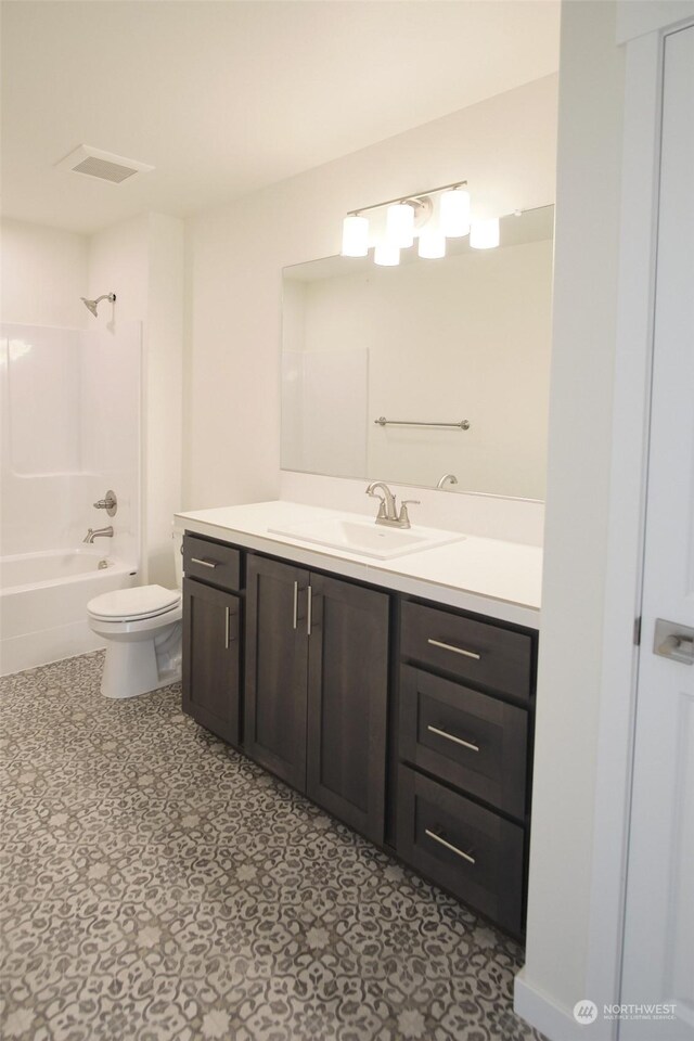 full bathroom with bathtub / shower combination, toilet, tile patterned floors, and vanity