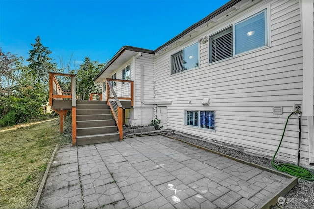 exterior space featuring a deck and a patio