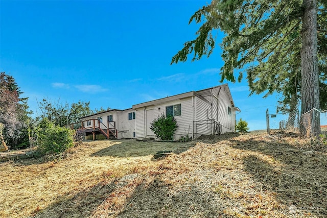 view of property exterior featuring a lawn