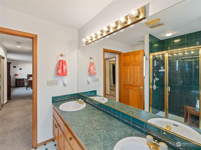 full bathroom with double vanity, a stall shower, ensuite bath, and a sink