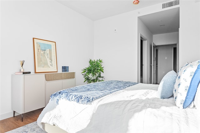 bedroom featuring hardwood / wood-style flooring