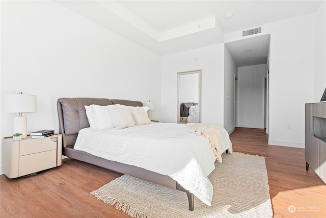 bedroom with light hardwood / wood-style floors