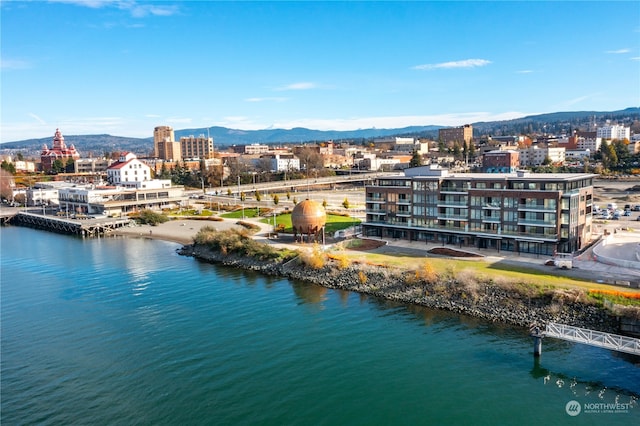 bird's eye view featuring a water and mountain view