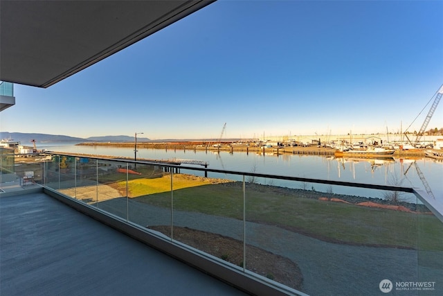 balcony featuring a water view