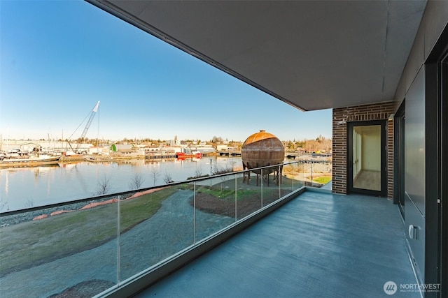 balcony featuring a water view