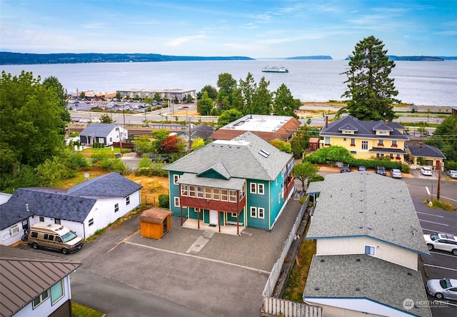 drone / aerial view with a water view