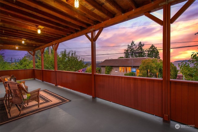 view of patio terrace at dusk