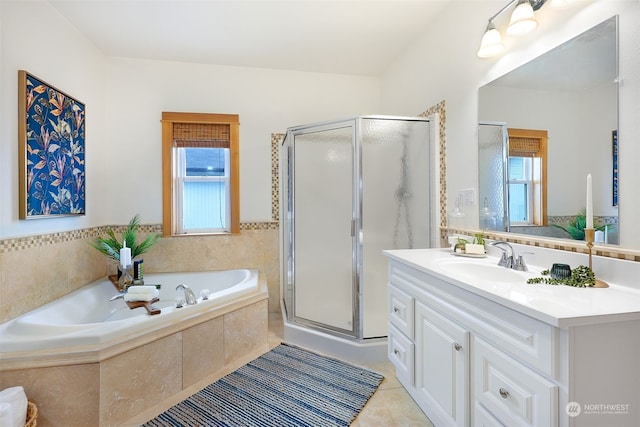 bathroom with tile patterned floors, plus walk in shower, and vanity