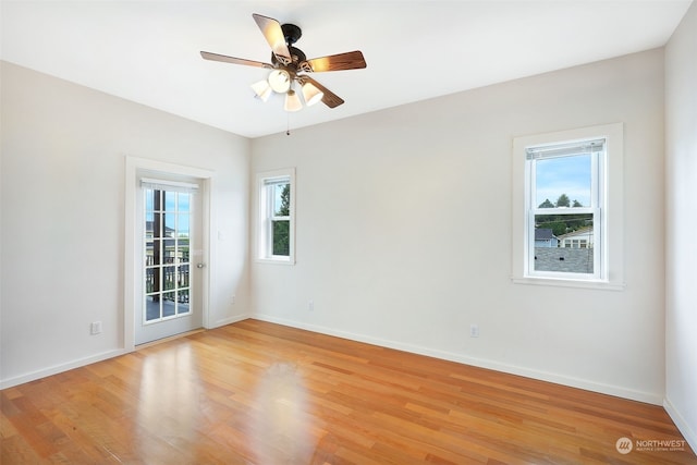 spare room featuring ceiling fan and light hardwood / wood-style flooring