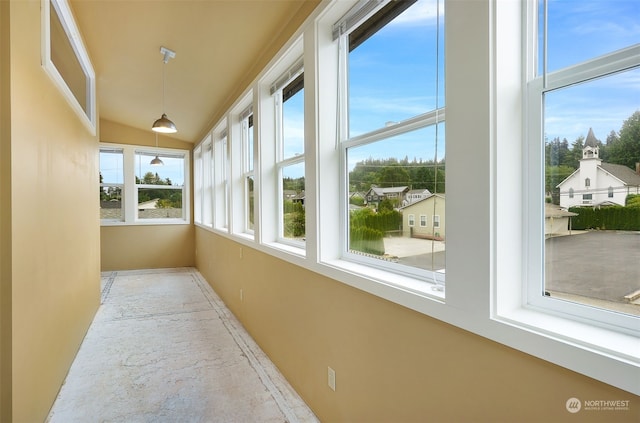 unfurnished sunroom featuring a healthy amount of sunlight