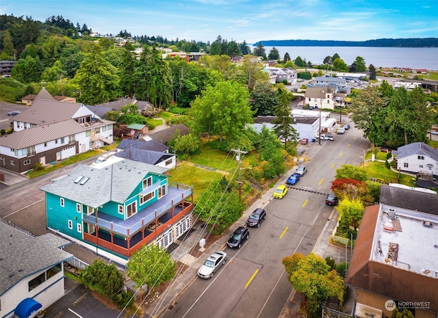 birds eye view of property featuring a water view