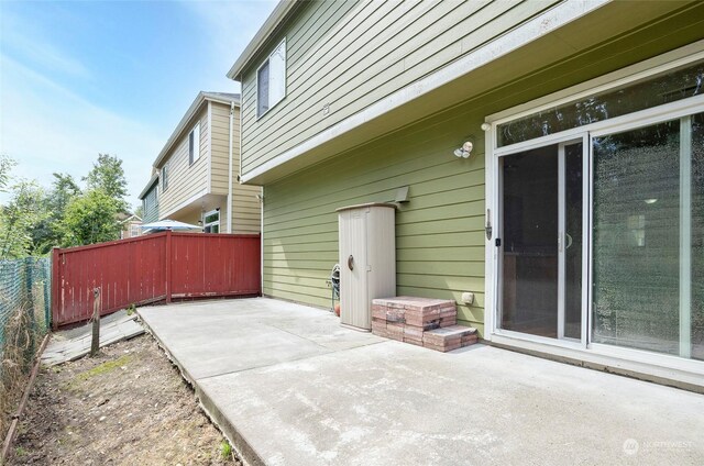 view of patio / terrace featuring fence