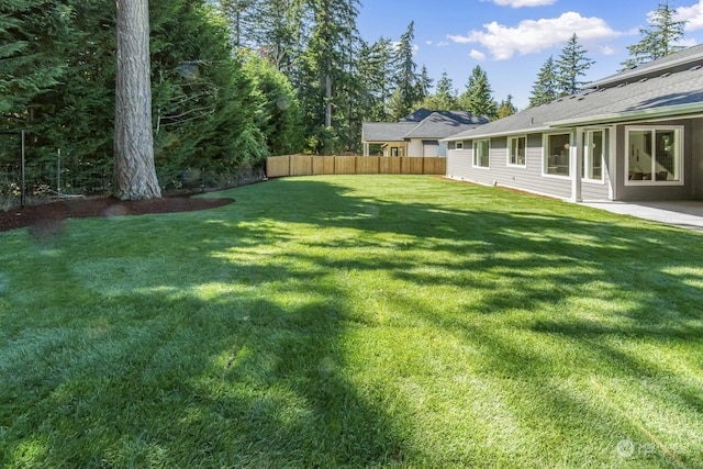 view of yard with fence