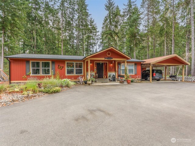 ranch-style home with a carport