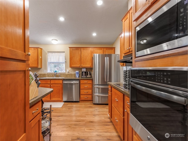 kitchen featuring light hardwood / wood-style flooring and stainless steel appliances