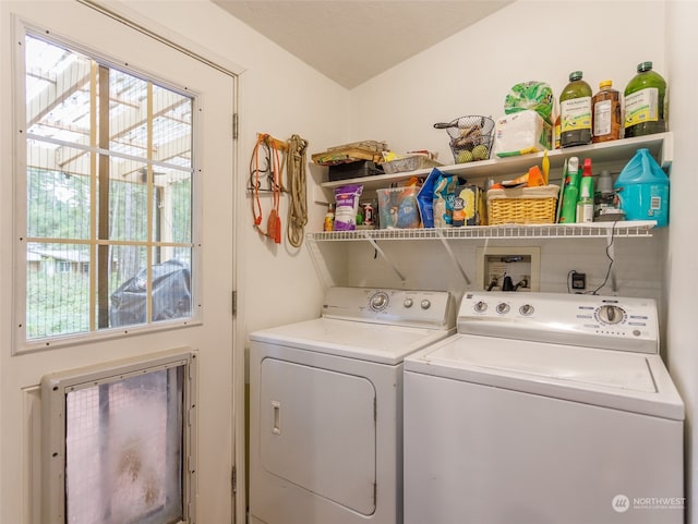 clothes washing area with washer and dryer