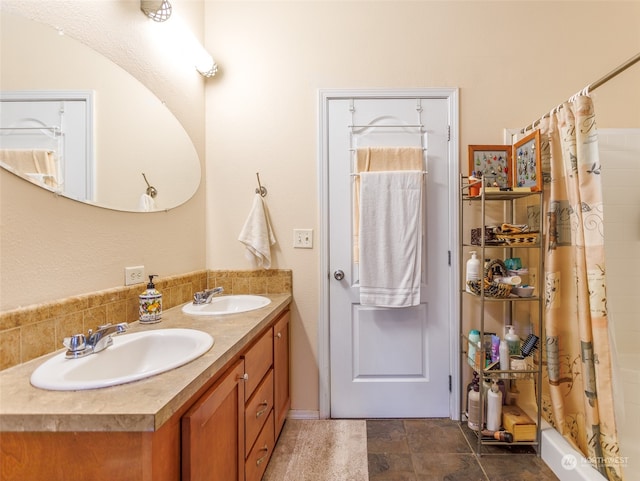 bathroom featuring tile patterned floors and double vanity