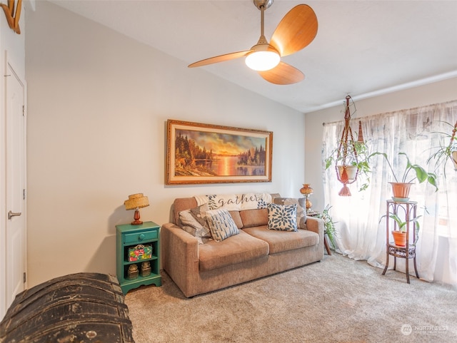 living room with lofted ceiling, carpet floors, and ceiling fan