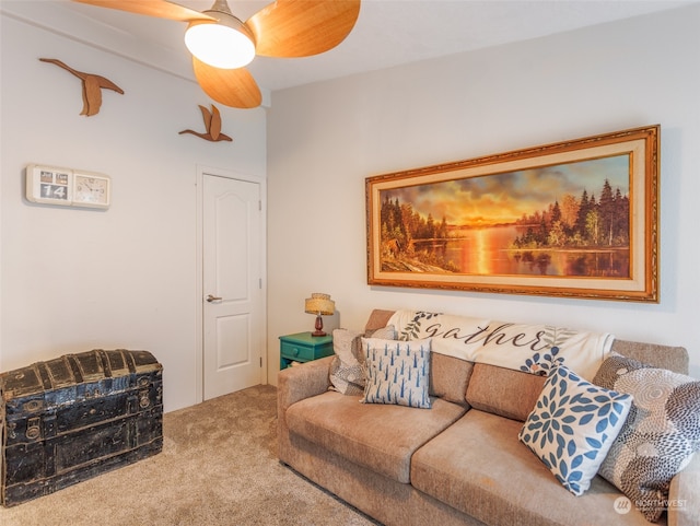 carpeted living room with ceiling fan