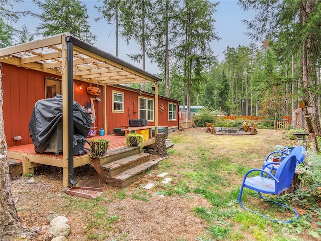 view of yard featuring a pergola and a wooden deck