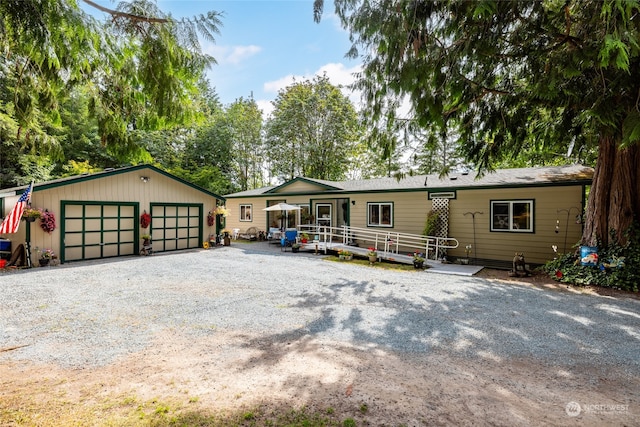 view of front of house with an outdoor structure and a garage