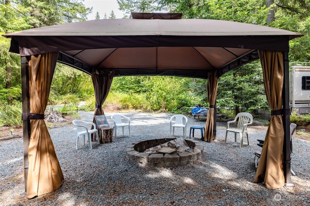 view of patio / terrace with a gazebo and an outdoor fire pit