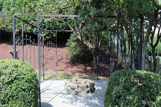 exterior space with a fire pit and a patio