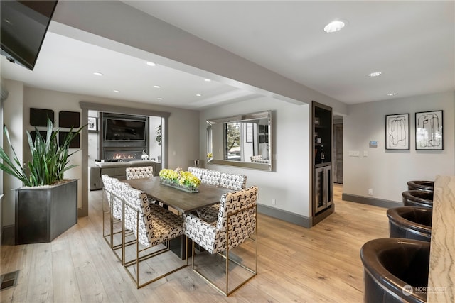 dining area with light hardwood / wood-style flooring