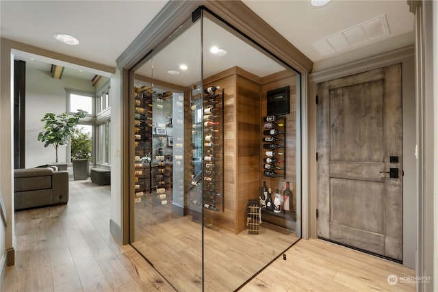 wine area featuring light wood-type flooring